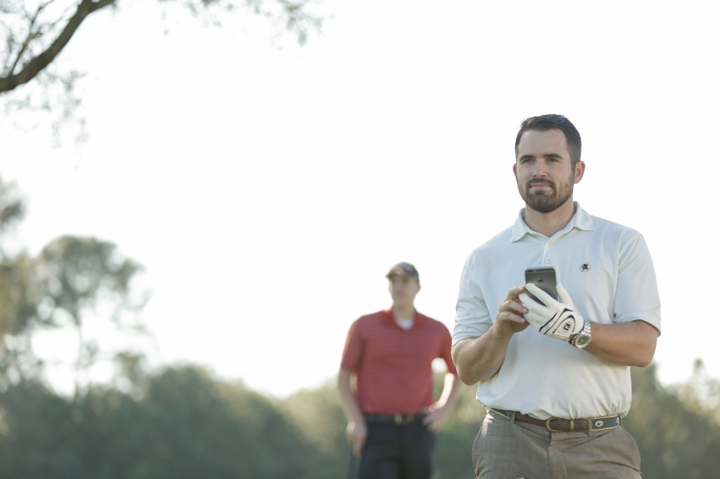 A golfer books a round on GolfNow's tee time software and distribution platform. 